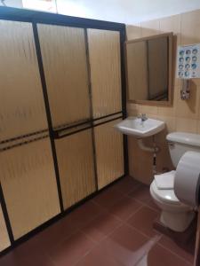 a bathroom with a toilet and a sink at Villas Josipek in Fortuna