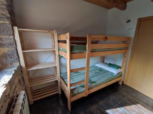 Postel nebo postele na pokoji v ubytování Albergue El Rebezo