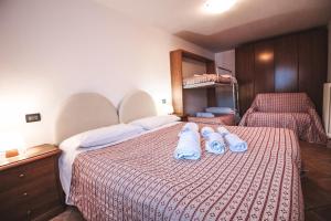 Postel nebo postele na pokoji v ubytování Residence Aquila - Bilo Testa di Comagna
