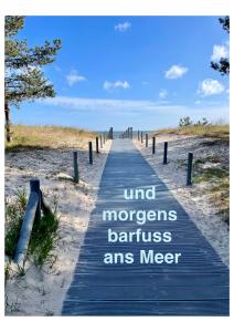 a wooden path to the beach with the words mind mappers barriersnancenancenance at Villa Harmonie in Ahlbeck