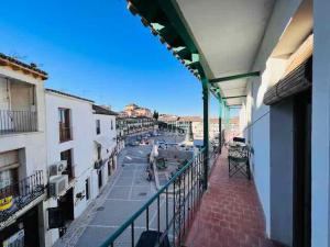 a balcony of a building with a view of a street at APCH5 Marga in Chinchón