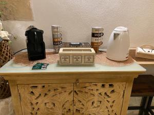 a table with a coffee maker and a blender on it at Loft Le Gemelle in Bari