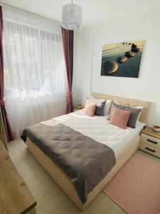 Ліжко або ліжка в номері Apartament Stefan Mamaia Nord