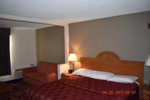 Postel nebo postele na pokoji v ubytování MHO Hotel Bordentown