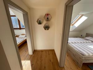 A bed or beds in a room at Mýto apartmán Poľana