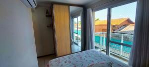 Postel nebo postele na pokoji v ubytování Nautilus Luz da Lua em Penha/SC + 30 fotografií