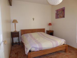 Giường trong phòng chung tại joli gite au calme proche d'Issoudun (17 km)