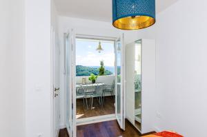 a view from the living room into the dining room at Apartment Rose Dubrovnik in Dubrovnik