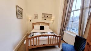 Letto o letti in una camera di The Guards Hotel