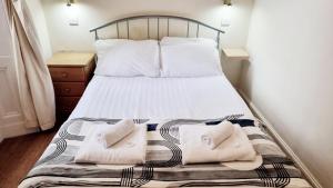 Letto o letti in una camera di The Guards Hotel