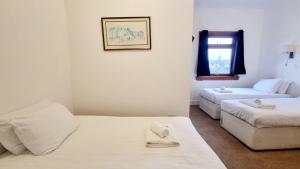 Letto o letti in una camera di The Guards Hotel