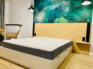 Postel nebo postele na pokoji v ubytování W Apartments