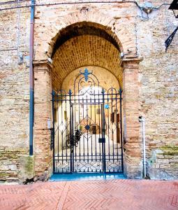 an entrance to a brick building with an iron gate at Bella Vista in Ortona