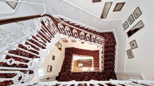 a staircase leading up to a stair case at The Guards Hotel in Edinburgh