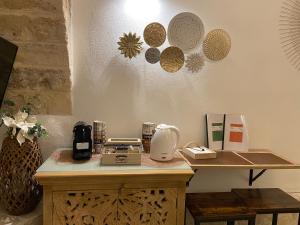 a kitchen with a counter with a coffee maker on it at Loft Le Gemelle in Bari