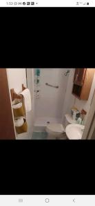 a bathroom with two toilets and a sink and a shower at A Touch of Madagascar in Fort Walton Beach with HEATING POOL in Fort Walton Beach