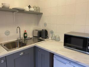 Η κουζίνα ή μικρή κουζίνα στο Buttermilk Lodge Guest Accommodation