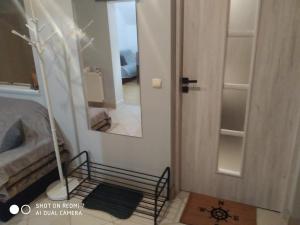 Posteľ alebo postele v izbe v ubytovaní Apartament przy Słonecznej