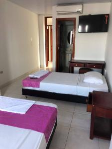 Voodi või voodid majutusasutuse Hotel Yurupary AMAZONAS toas