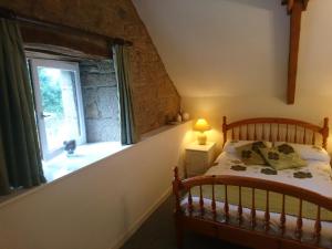 Łóżko lub łóżka w pokoju w obiekcie Gîte La Grange