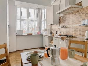 a kitchen with a table with a plate of food at simsimdoba in Chernivtsi