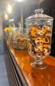 a glass jar filled with nuts on top of a counter at Gosterisli Otel in Duzce