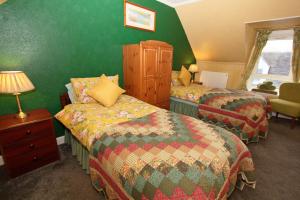 Postel nebo postele na pokoji v ubytování Braeside Guest Rooms