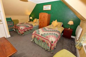 Postel nebo postele na pokoji v ubytování Braeside Guest Rooms + 11 fotografií