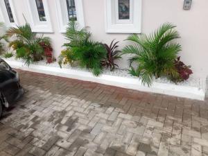 a group of plants on the side of a building at Lekki Conservation Luxury Palace 5 Bedrooms, with Fast Wi-Fi Fibre Broadband in Lekki not Ibeju in Ibeju