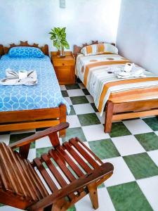 Un pat sau paturi într-o cameră la El Curichal Hostel