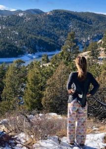 a woman standing on top of a snow covered mountain at Boulder Best City and Nature with Lake and Trails PETS OK in Boulder