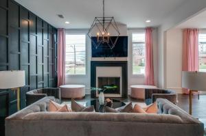 a living room with a couch and a fireplace at 4 Connecting Condos - Sleeps 32 to 36 - Firepits - Garages - Rooftops decks - Great Views - Security in Nashville