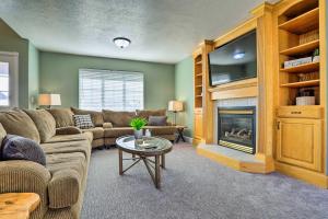 a living room with a couch and a fireplace at Spacious Family Home, 3 Mi to Dtwn Cedar City in Cedar City