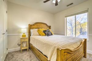 a bedroom with a bed and a window at Spacious Family Home, 3 Mi to Dtwn Cedar City in Cedar City