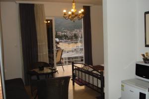 a living room with a chandelier and a room with a view at Villa Espero in Trogir
