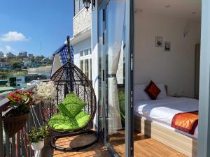 Ένα ή περισσότερα κρεβάτια σε δωμάτιο στο Biệt Thự Du Lịch Út Thảo Đà Lạt