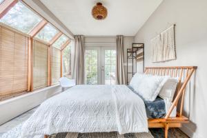 a bedroom with a bed and a window at Hood Hideaway in Welches +54 photos