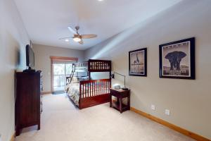a bedroom with a bed and a ceiling fan at Snow Porch in Truckee +31 photos