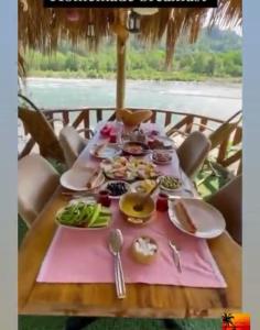 a table with plates of food on top of it at Dere Evi in Rize +45 photos