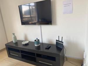 A television and/or entertainment centre at Beach View