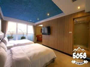 Postel nebo postele na pokoji v ubytování R8 Eco Hotel