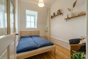Postel nebo postele na pokoji v ubytování Eigene Wohnung im Stadtzentrum mit wunderschöner Dachterrasse