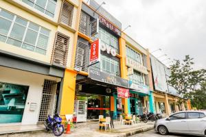 a car parked in front of a building at OYO 90460 Hotel Kl2f Rest & Go in Shah Alam