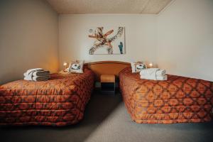 Кровать или кровати в номере Seasons Hotel Newman