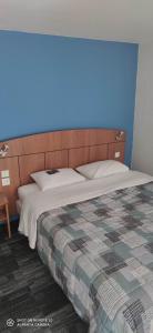 Ένα ή περισσότερα κρεβάτια σε δωμάτιο στο Kyriad Mulhouse Est - Lutterbach
