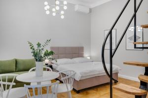 Posteľ alebo postele v izbe v ubytovaní Palace Apartments