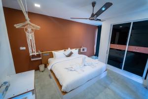 Postel nebo postele na pokoji v ubytování Merijaan Maldives