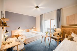 Postel nebo postele na pokoji v ubytování Bavaria Biohotel