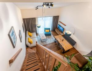 Televízia a/alebo spoločenská miestnosť v ubytovaní Apartmány Resort Vrchlabí