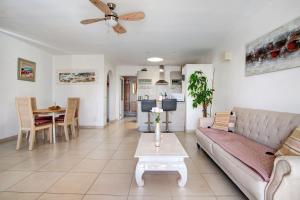 a living room with a couch and a table at Puerto Chico P in Playa Blanca